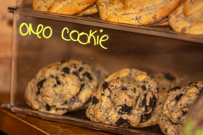 Oreo cookies stacked in a display box with a handwritten label